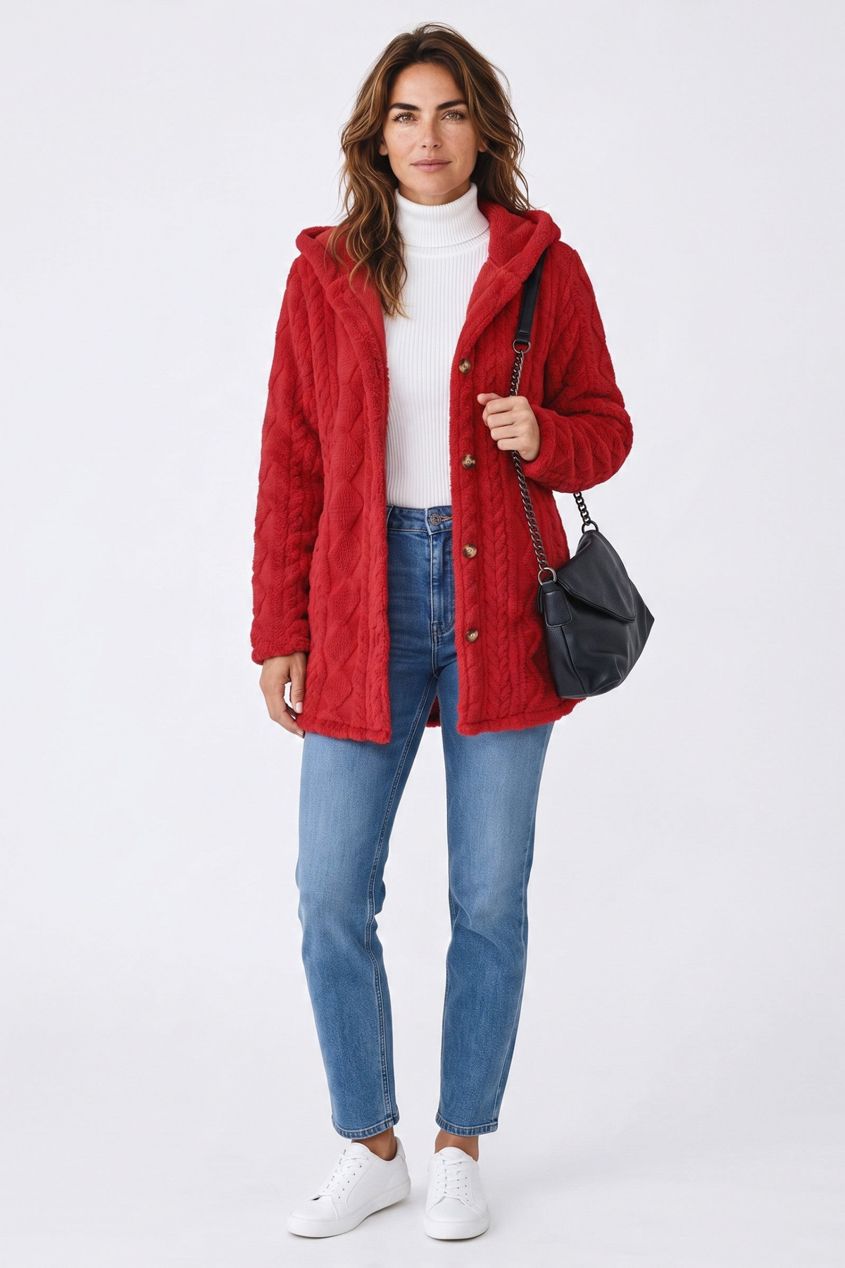Model wearing a Baya Wear red longline hooded fleece cardigan with cable texture, button front, and side details.