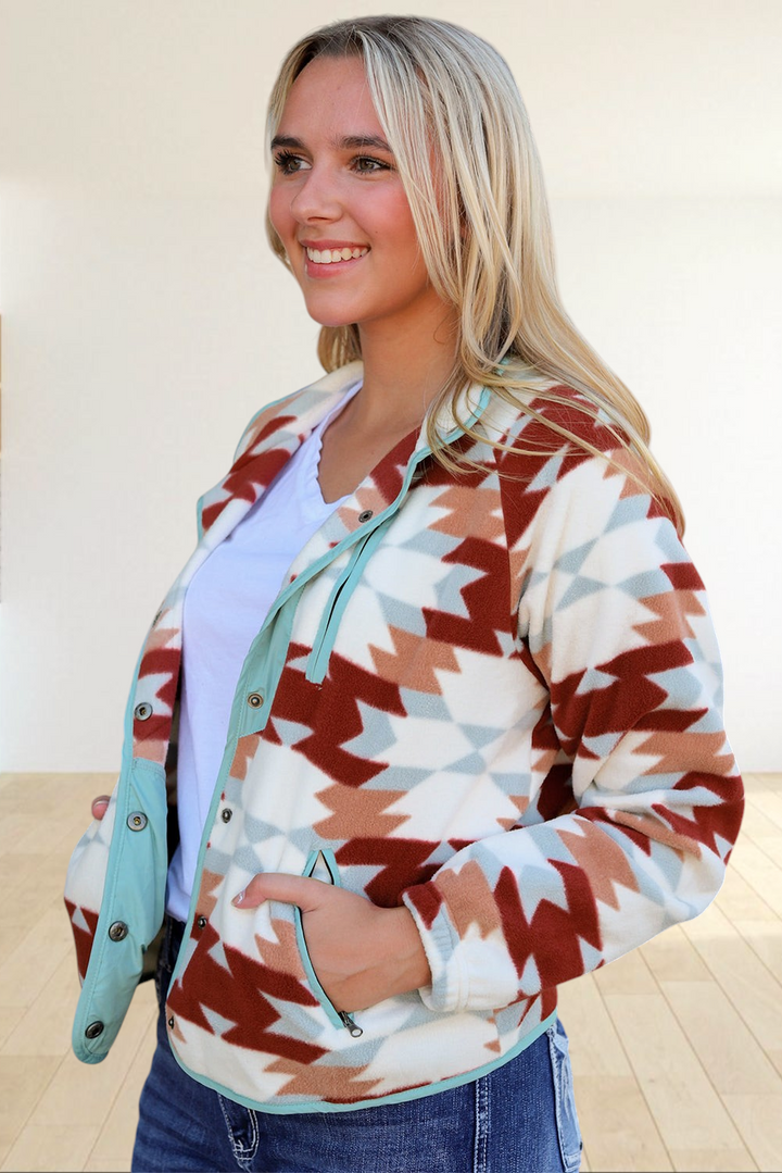 Baya Wear fleece snap jacket featuring a fiery red and cream Aztec geometric pattern with light blue trim