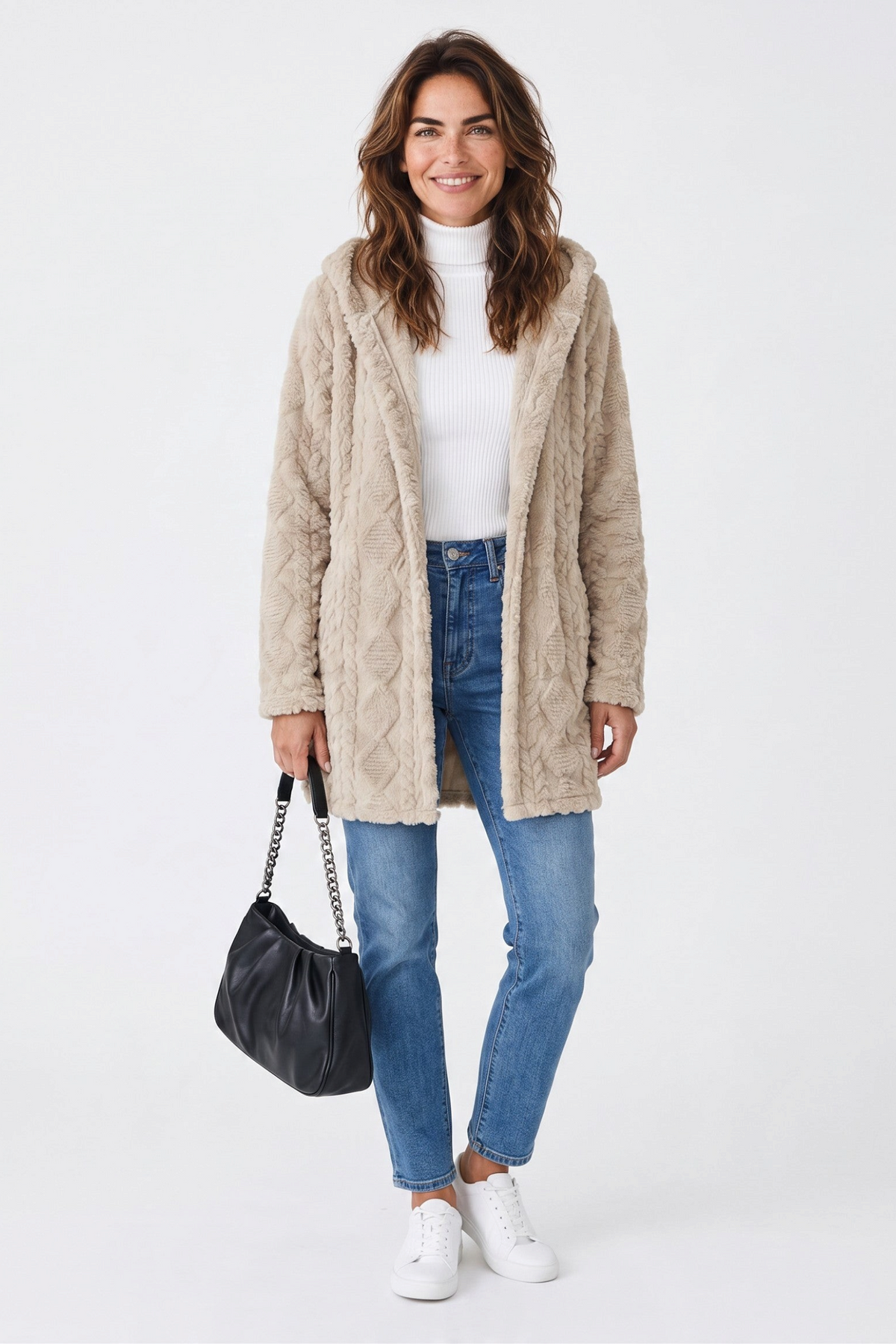 Baya Wear beige hooded fleece cardigan with cable texture, worn over a white turtleneck and blue jeans