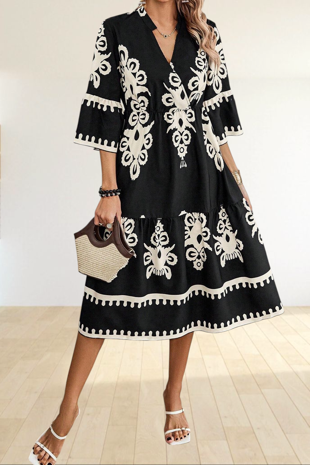 Baya Wear black and beige geometric print midi dress with V-neck, 3/4 sleeves, and tiered skirt design.