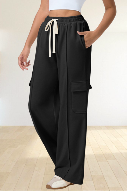 Baya Wear black high-waisted wide-leg cargo sweatpants with side patch pockets and a cream drawstring waist