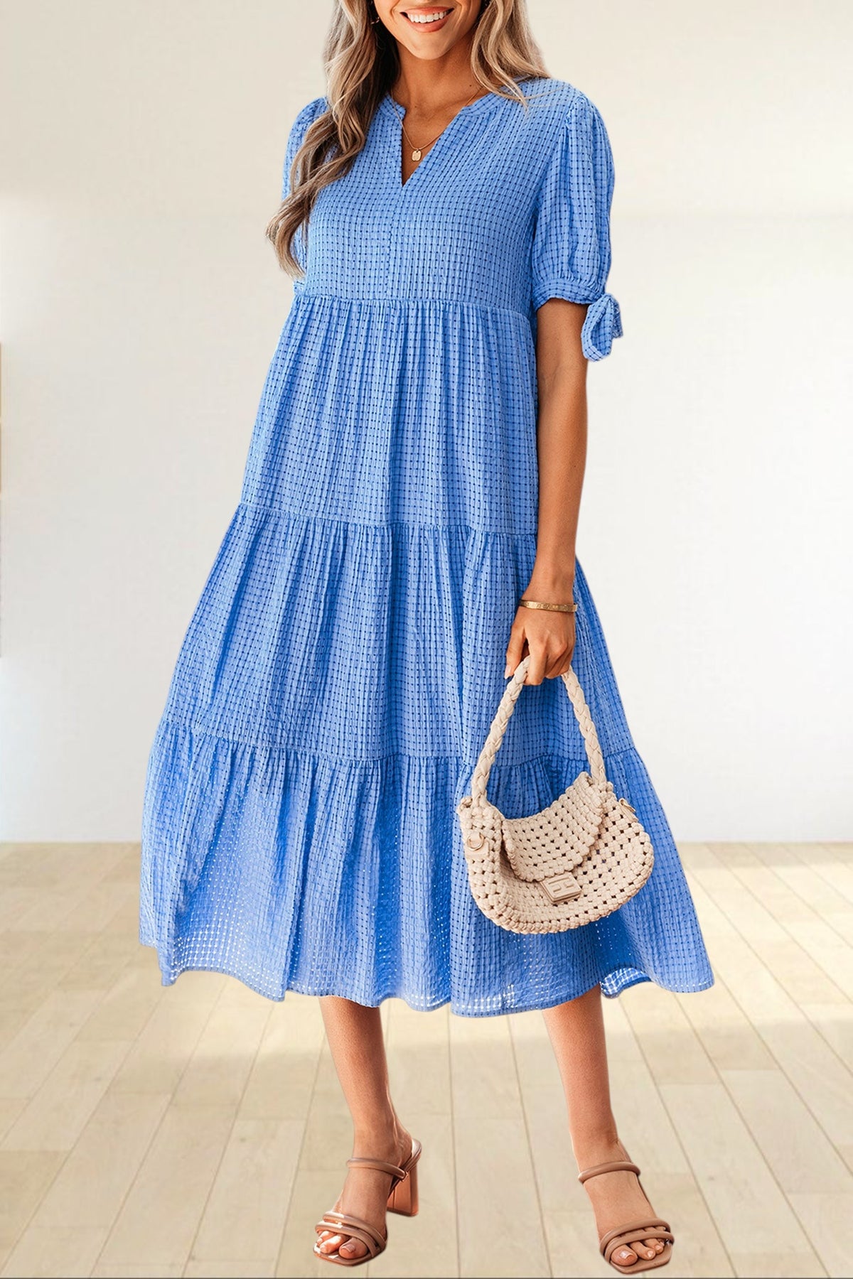 Baya Wear blue textured gingham tiered midi dress with V-neck, short sleeves with bow ties, and side pockets.