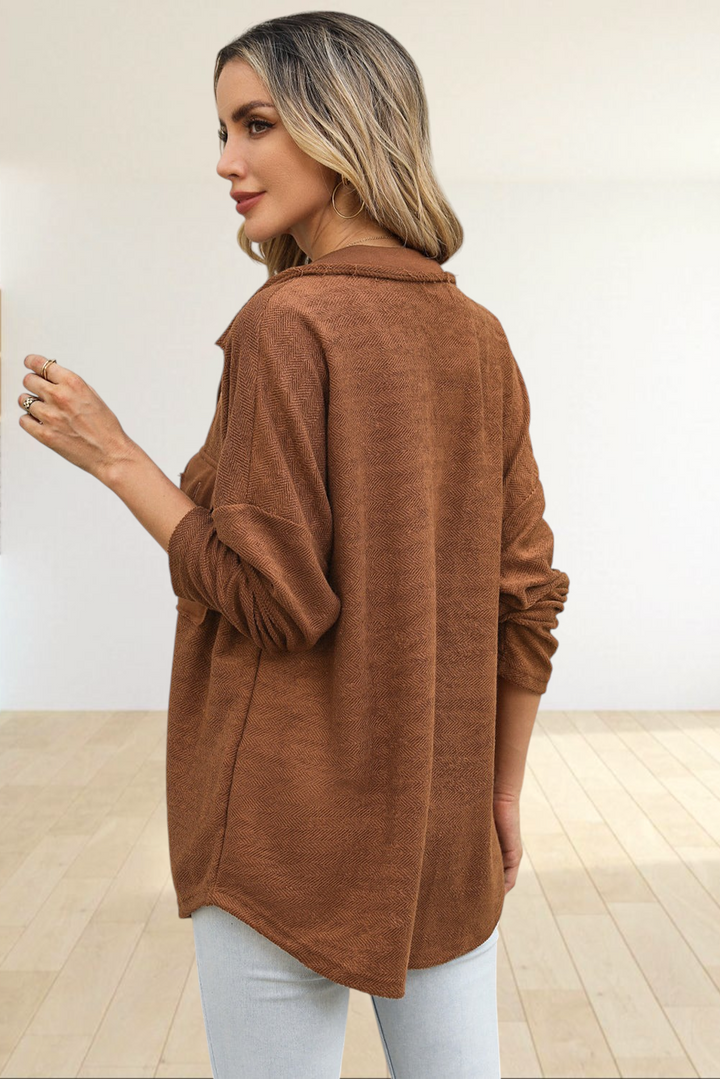 Baya Wear brown textured herringbone shacket with a relaxed oversized fit worn by a woman from a side view