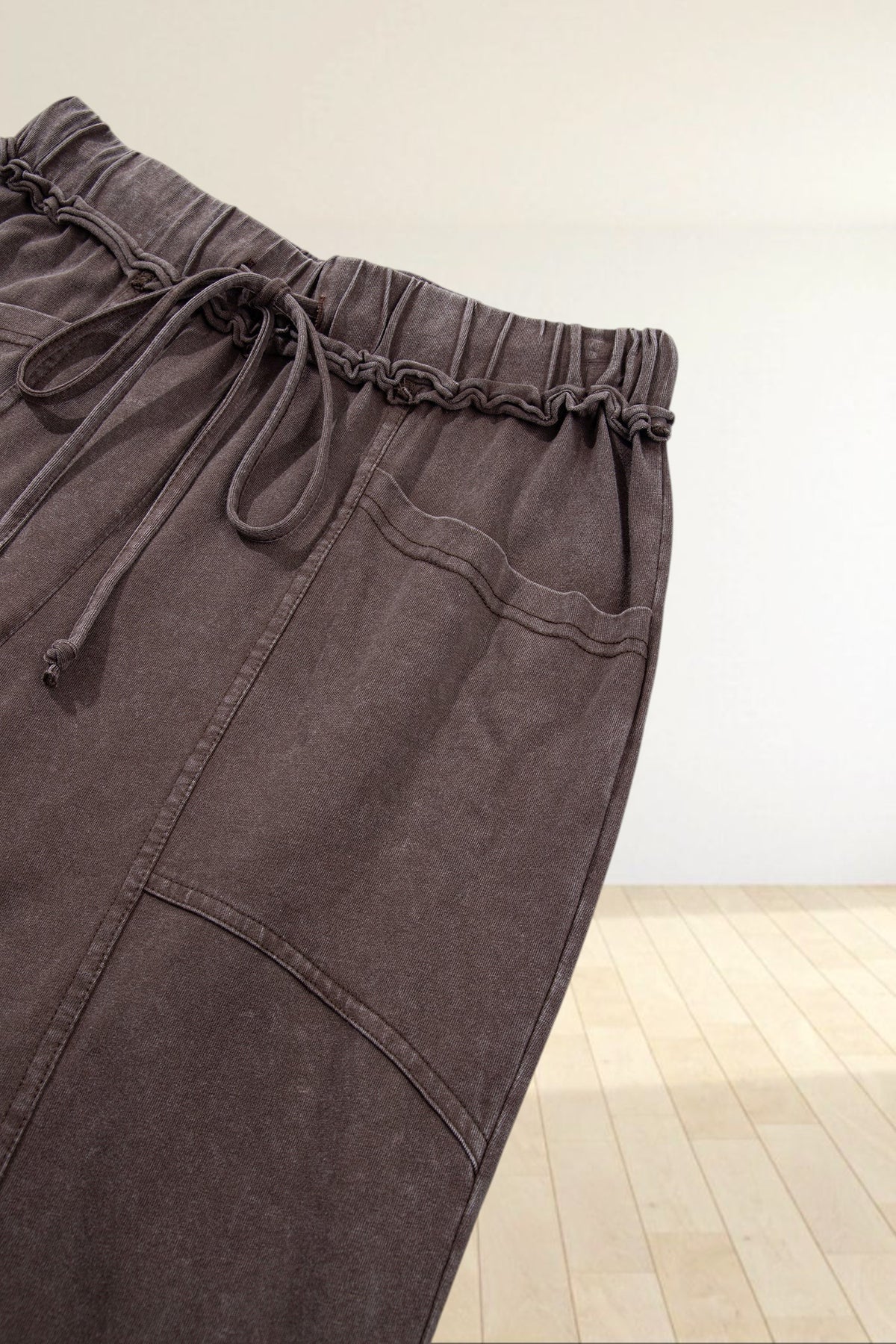 Baya Wear brown mineral wash lounge pants with a drawstring waist, elasticated waistband, and front seam detailing.