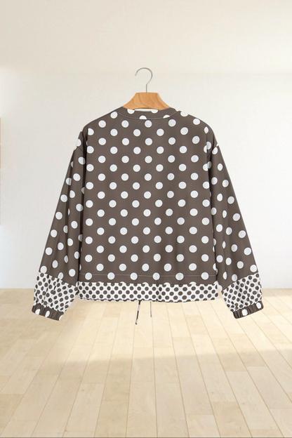 Baya Wear brown bomber jacket with white polka dots, contrast pattern hem and cuffs, and a drawstring waist.