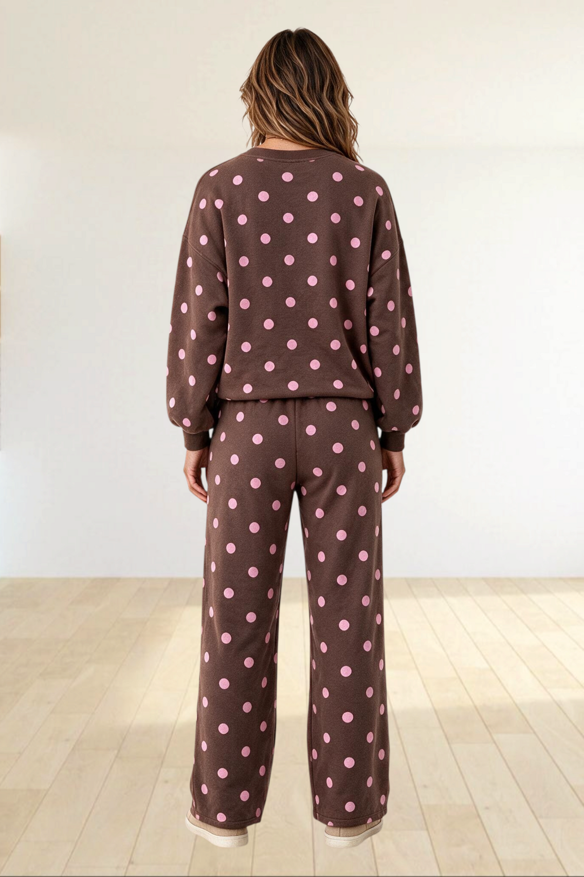 Baya Wear brown and pink polka dot lounge set with crewneck sweatshirt and wide leg pants, back view