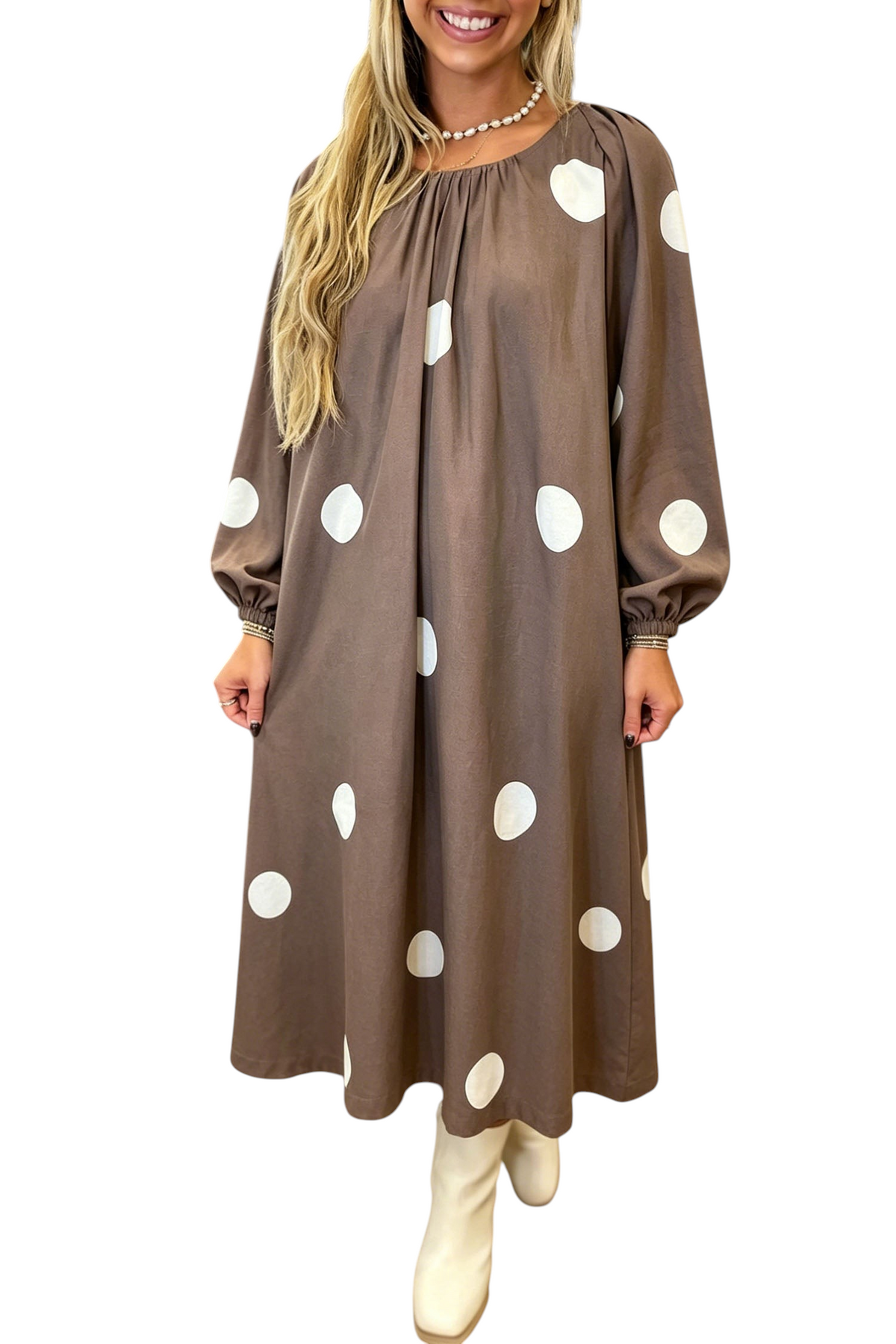 Baya Wear brown midi dress with white polka dots, long sleeves, and a gathered neckline worn by a blonde woman.