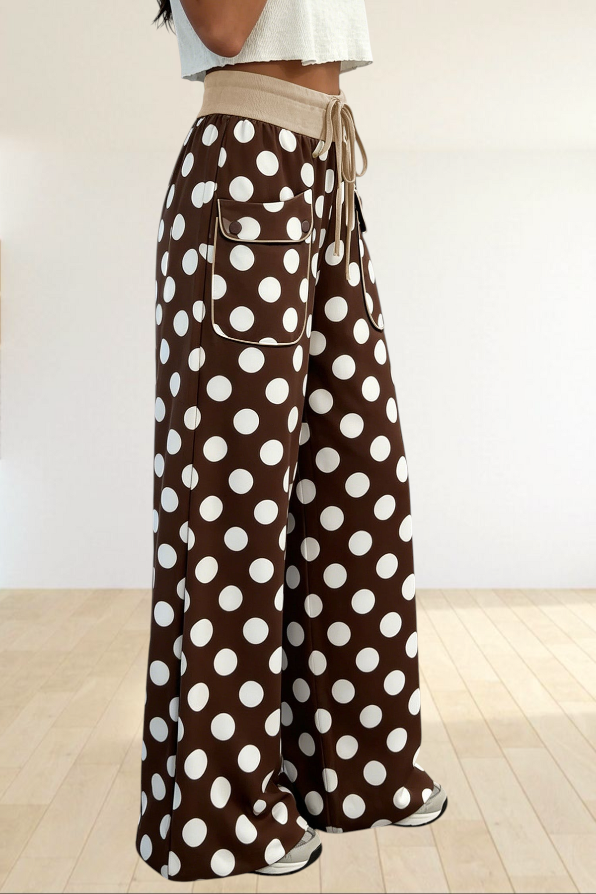 Baya Wear brown wide-leg trousers with white polka dots, featuring a beige drawstring waist and front patch pockets.