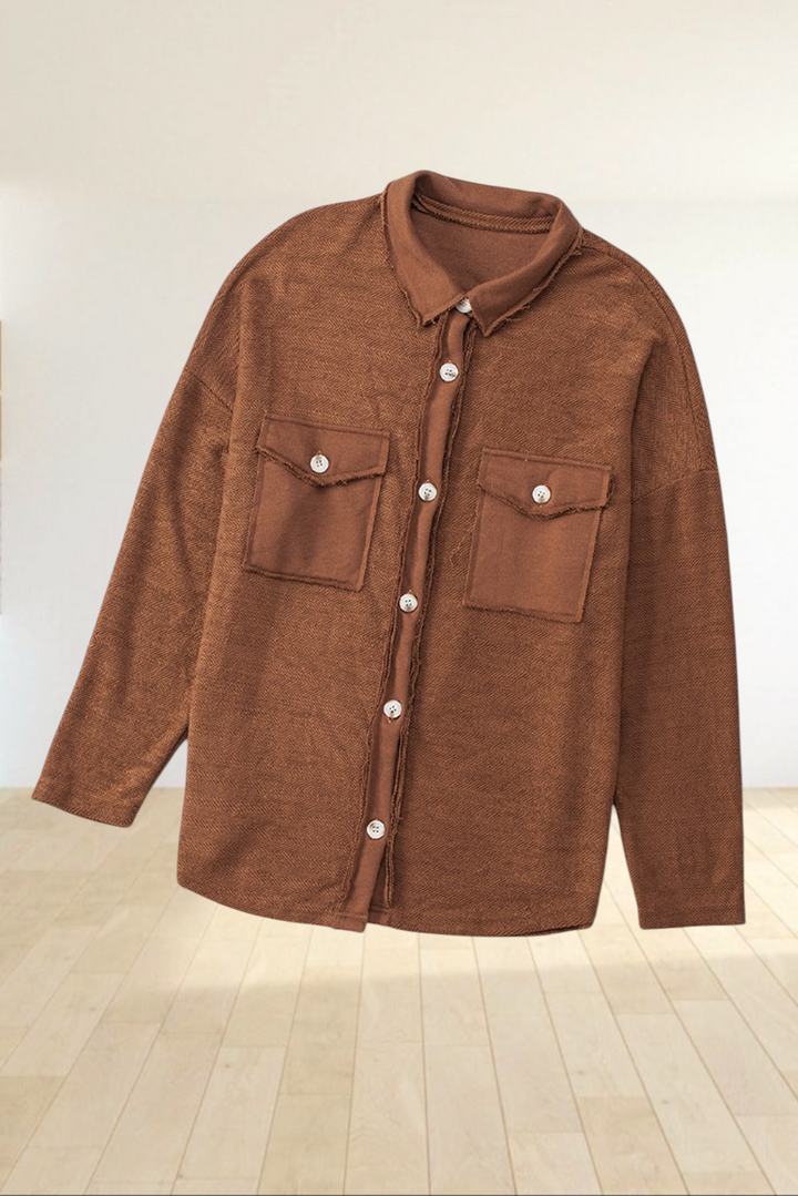 Baya Wear brown textured shacket with button-down front, chest flap pockets, and raw-edge detailing.