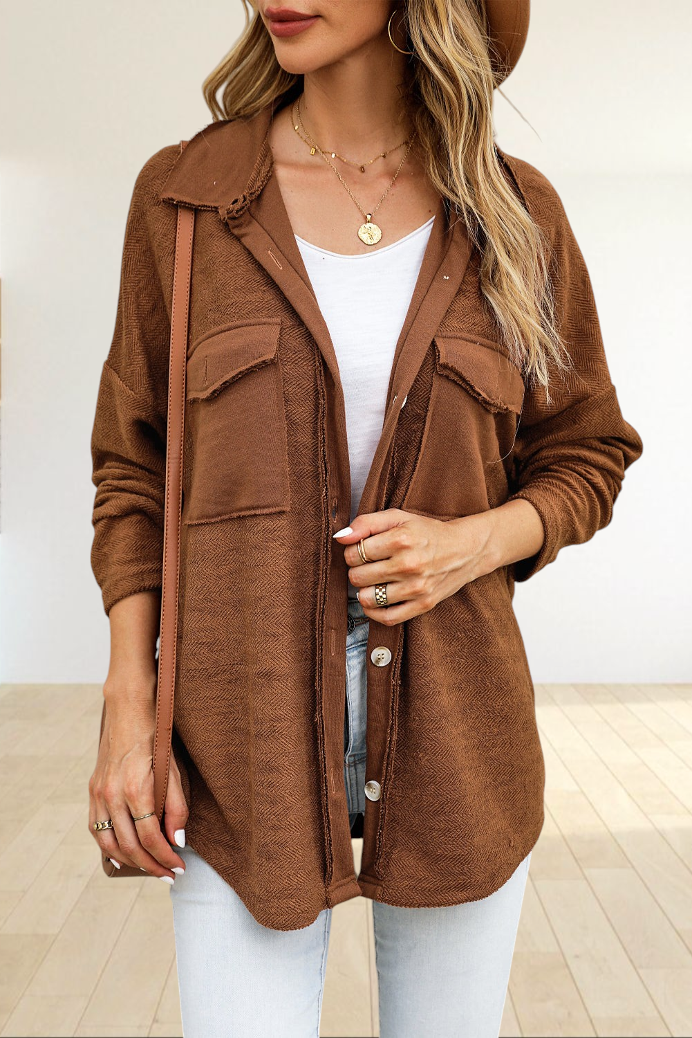 Baya Wear brown textured shacket with contrast flap pockets, raw-edge detailing, and a relaxed oversized fit.