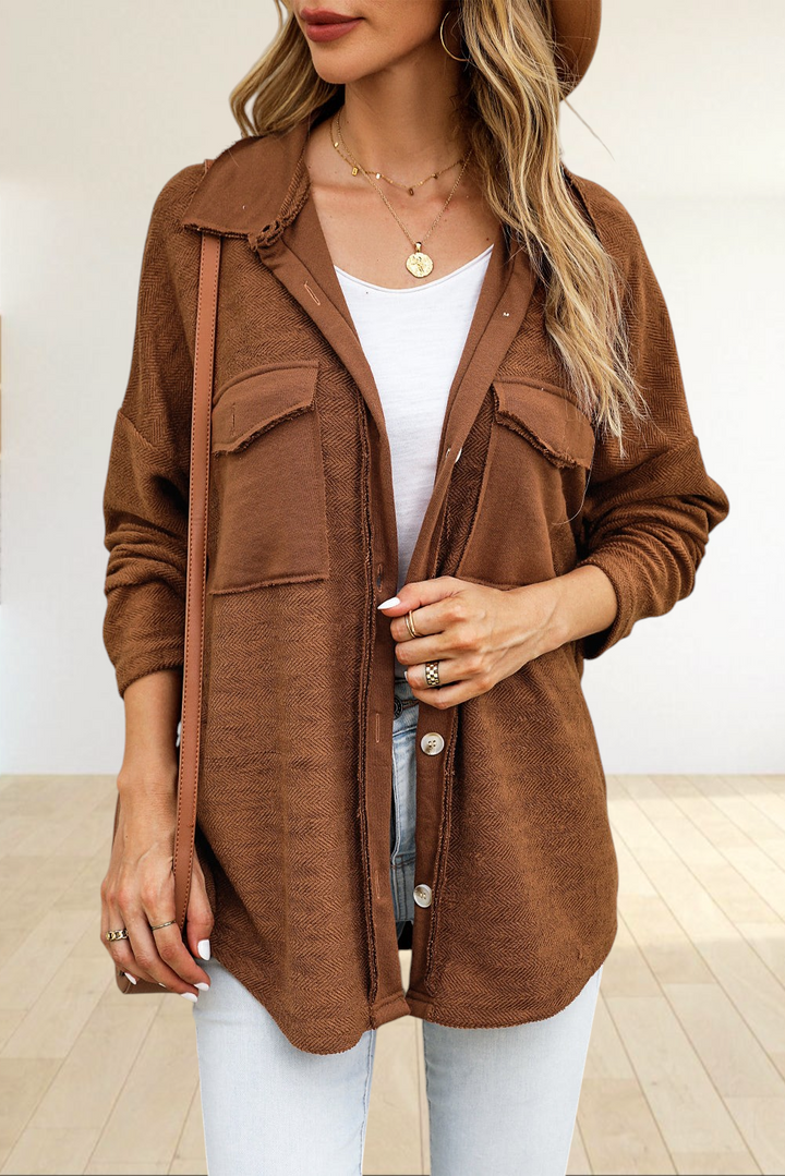 Baya Wear brown textured shacket with contrast flap pockets, raw-edge detailing, and a relaxed oversized fit.