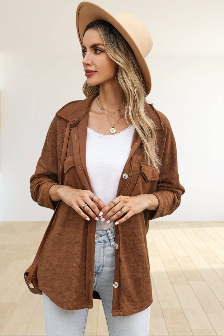 Baya Wear brown textured button-down shacket with flap pockets worn by a woman in a beige fedora and light denim jeans