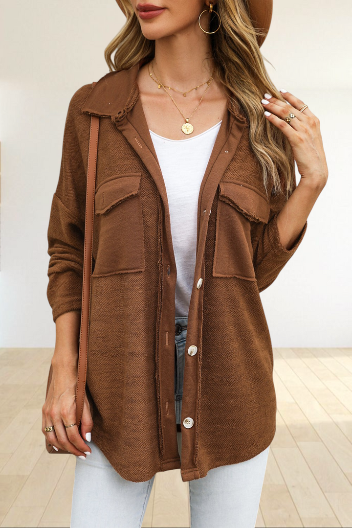 Baya Wear brown textured shacket with contrast flap pockets, button-down front, and raw-edge detailing on a model.
