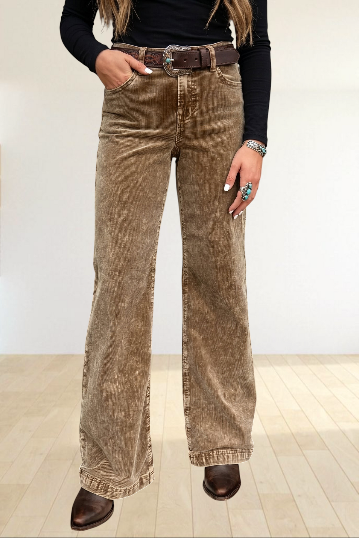 Baya Wear high rise camel corduroy wide leg pants with a western belt, styled in a rustic setting.