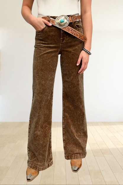 Baya Wear camel corduroy wide leg pants with a high rise fit, styled with a western turquoise belt and boots.