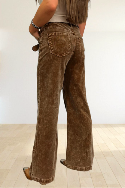 Baya Wear camel corduroy wide leg pants with back pockets, styled with western boots in a rustic room setting.