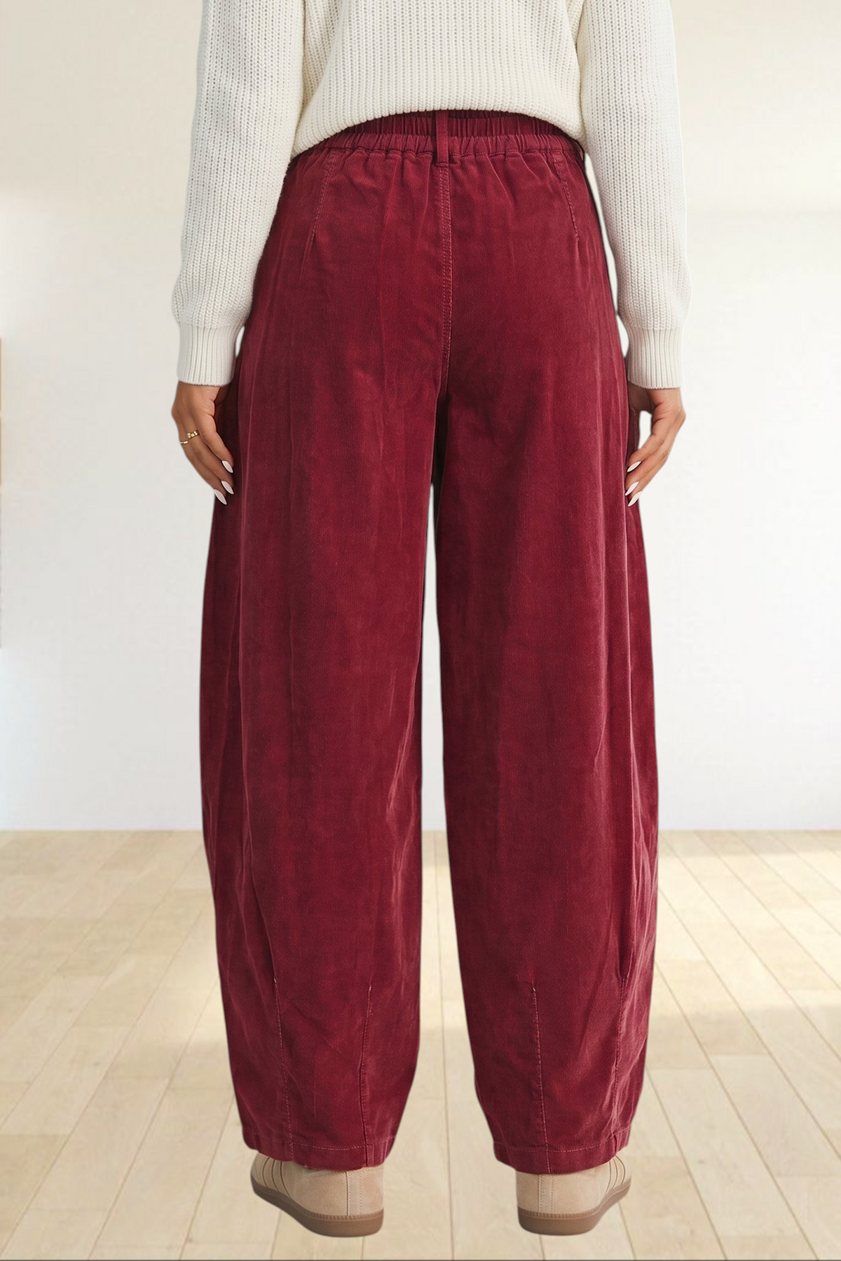 Baya Wear chestnut corduroy trousers with a relaxed wide-leg fit, elastic waistband, and back view on a model.