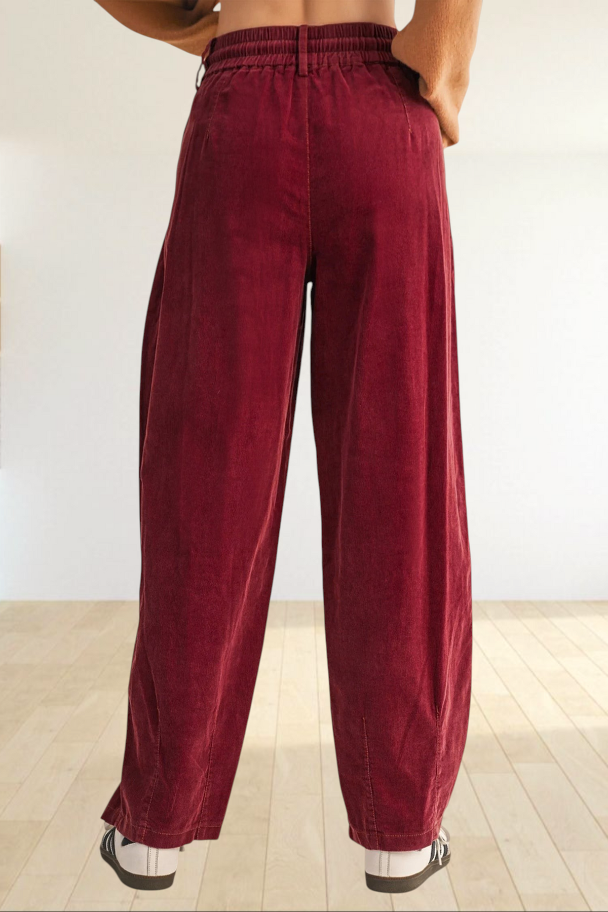 Baya Wear chestnut corduroy trousers featuring a relaxed wide-leg fit, elastic waistband, and back view.