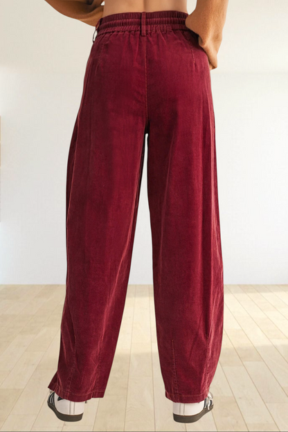 Baya Wear chestnut corduroy trousers featuring a relaxed wide-leg fit, elastic waistband, and back view.
