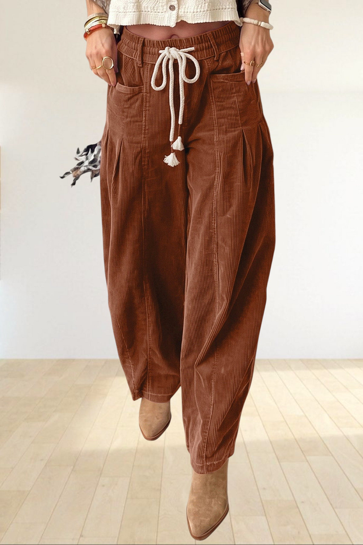 Baya Wear chestnut corduroy trousers featuring a relaxed wide-leg fit, elastic drawstring waist, and side pockets.