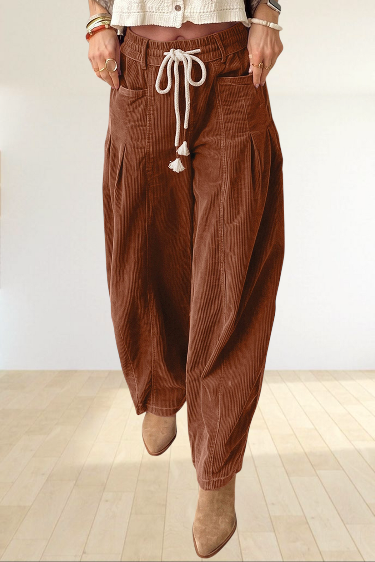 Baya Wear chestnut brown wide-leg corduroy trousers with an elastic drawstring waist and tassel details