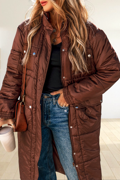 Baya Wear coffee brown mid-length quilted puffer jacket with stand neck, zip closure, and snap-button flap pockets.