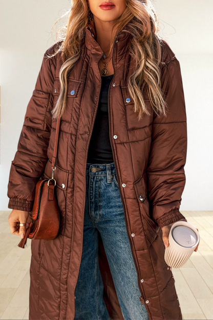 Baya Wear coffee brown quilted mid-length puffer jacket with a stand neck, zip front, and snap-button pockets.