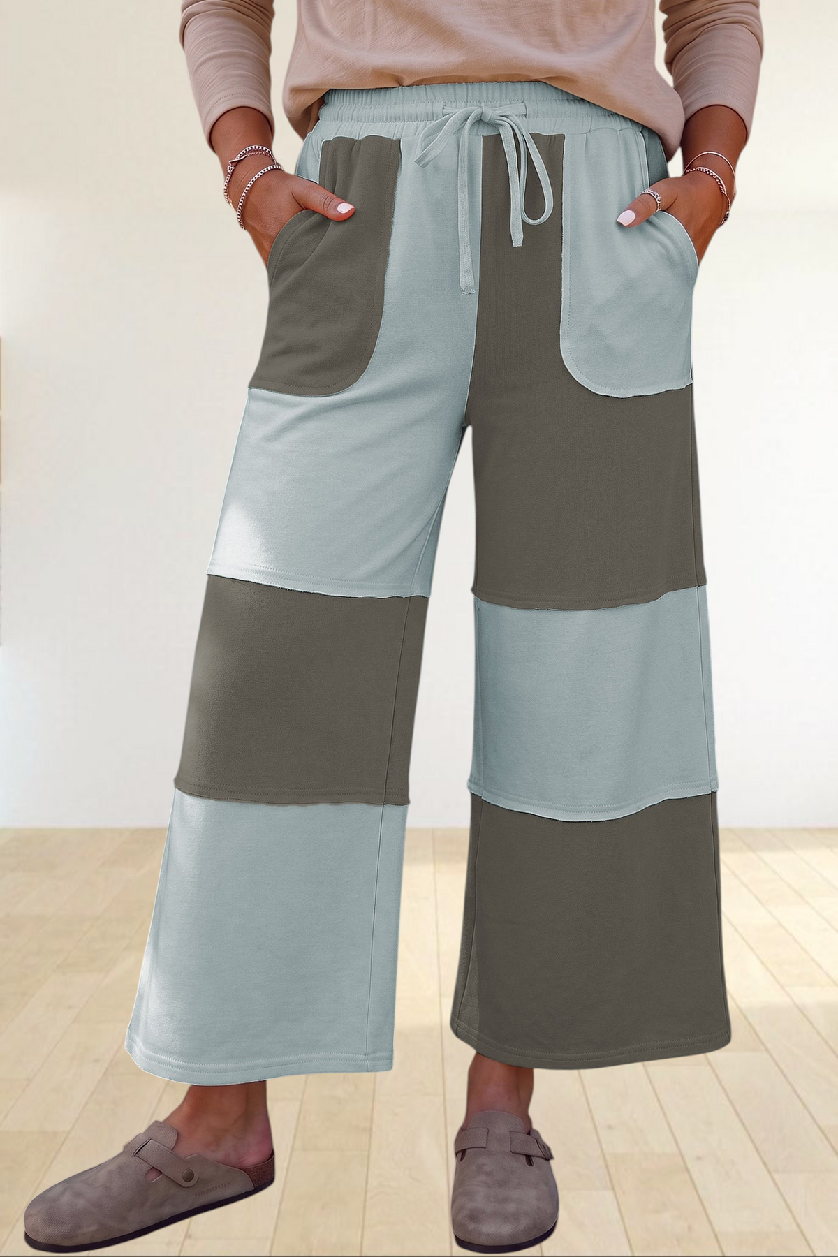 Baya Wear color block wide-leg lounge pants in sage and olive green with a drawstring waist and raw-edge pockets.