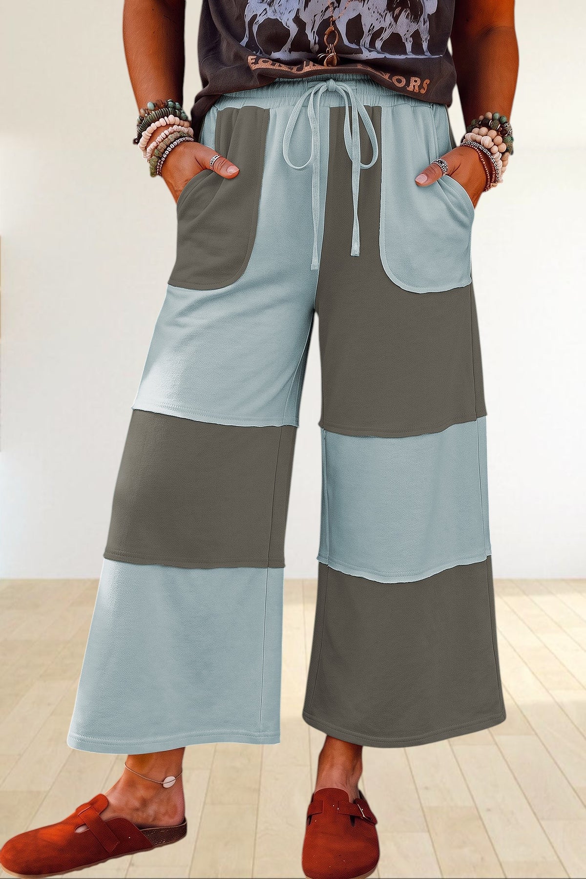 Baya Wear color block wide-leg lounge pants with raw-edge patchwork seams, drawstring waist, and side pockets.
