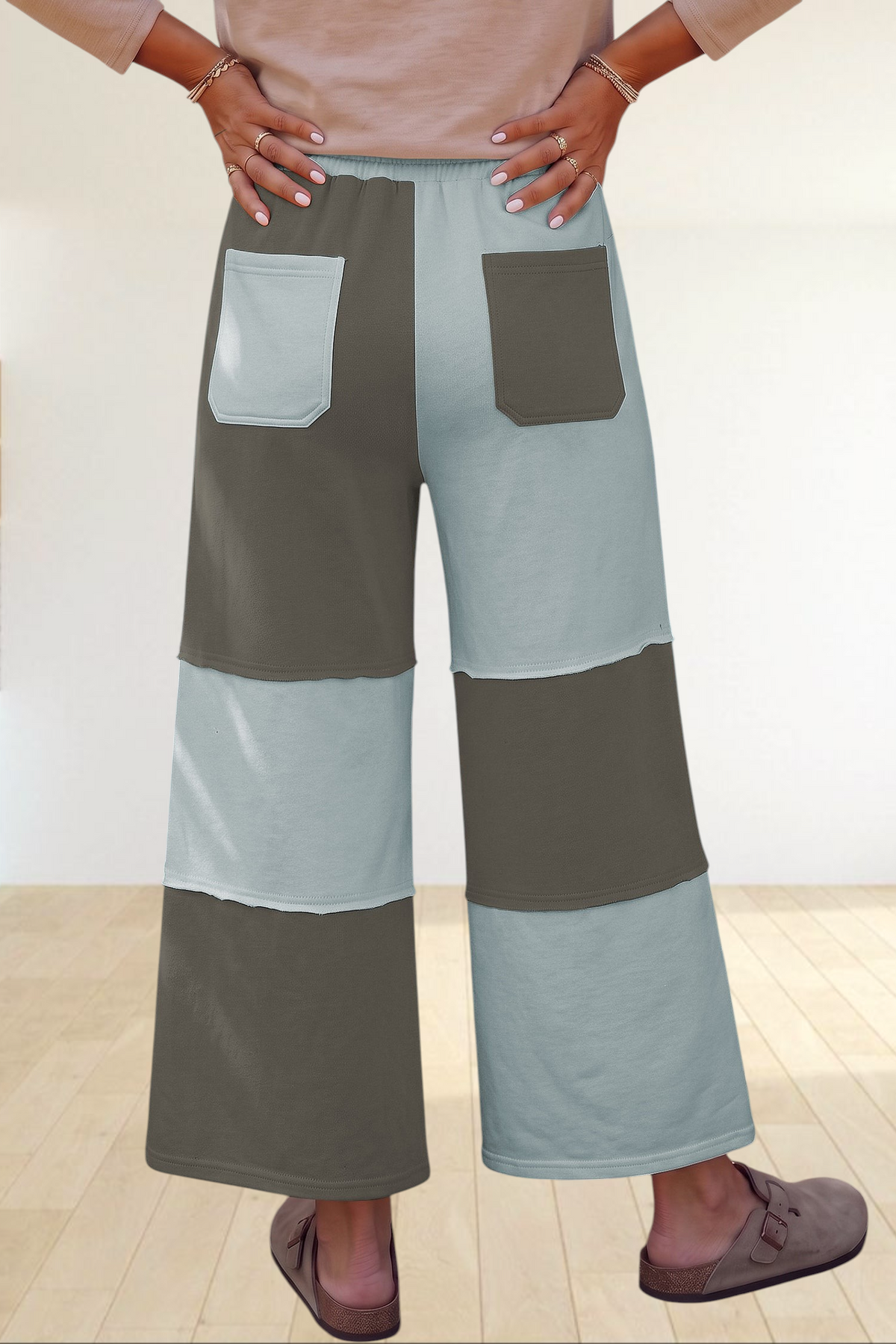 Baya Wear color block wide-leg lounge pants with raw-edge seams, back patch pockets, and an elastic drawstring waist.