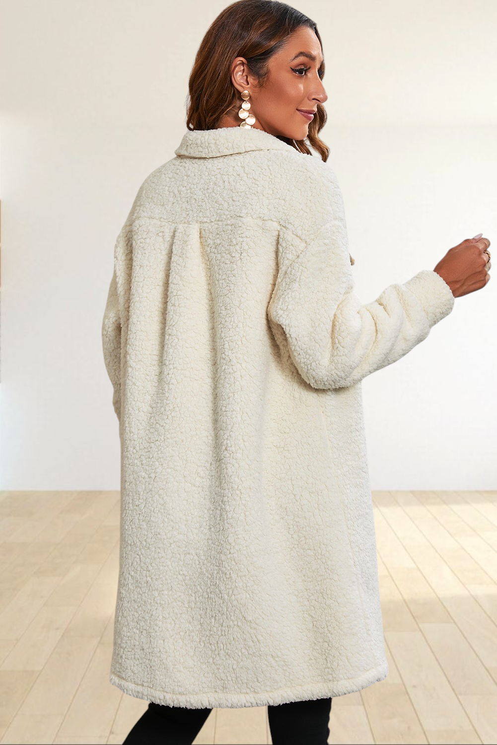 Baya Wear longline cream teddy fleece shacket worn by a woman, back view showing soft plush texture and collar detail.