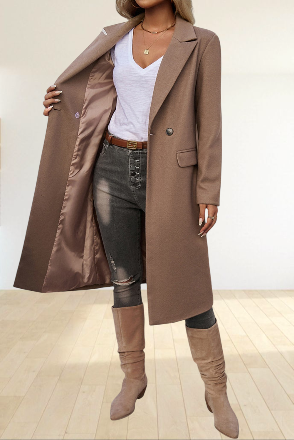 Baya Wear dark khaki single-breasted longline overcoat with lapel collar worn over a white tee and distressed jeans.