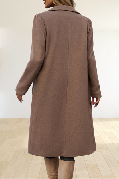 Baya Wear dark khaki longline tailored overcoat with a structured silhouette and lapel collar, back view.