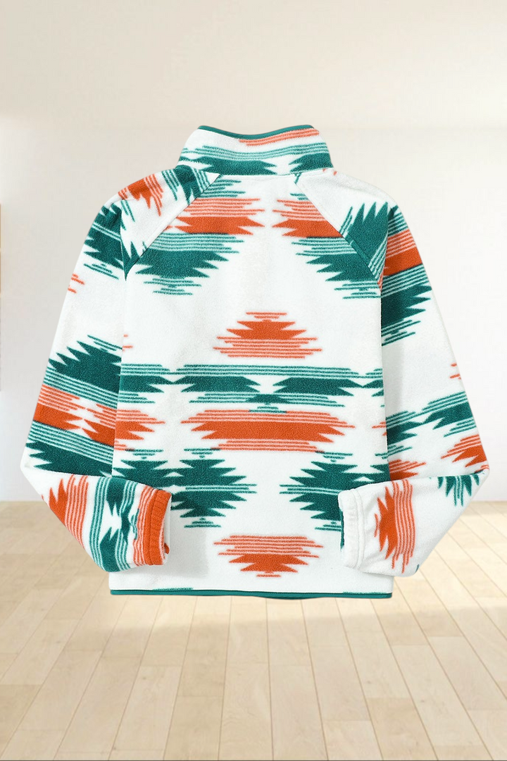 Back view of Baya Wear fleece jacket featuring a geometric pattern in orange and forest green on a cream background.