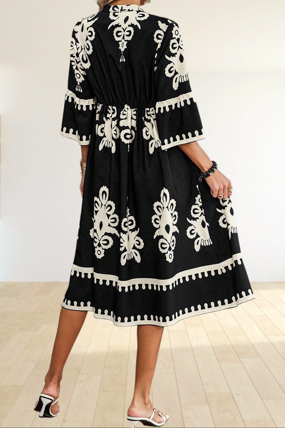 Baya Wear black and beige geometric print midi dress with 3/4 sleeves and tiered skirt, back view