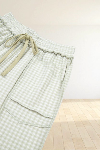 Baya Wear light green and white gingham lounge pants with an elastic drawstring waist and large front patch pockets.