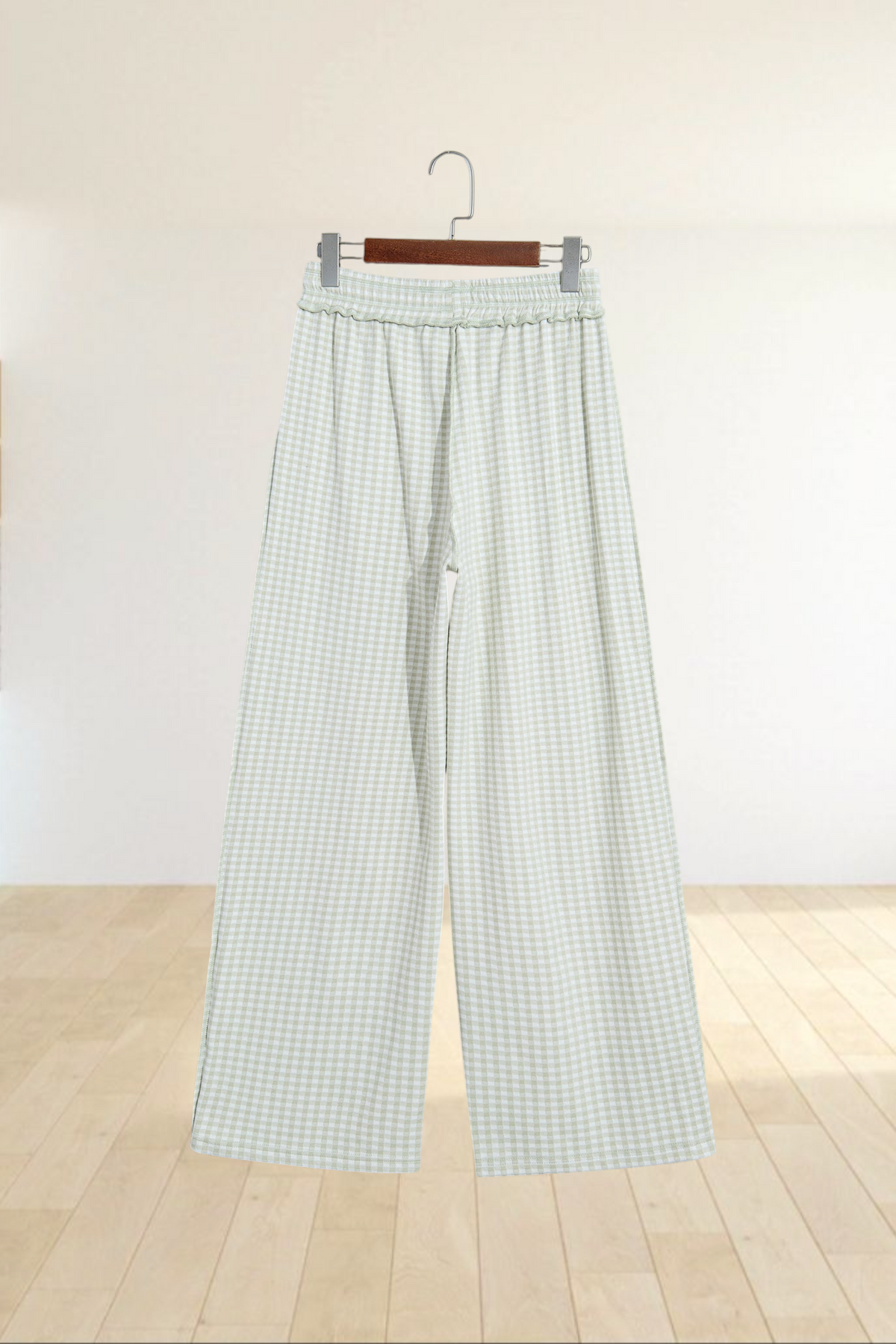 Baya Wear wide leg lounge pants in a light green and white gingham plaid pattern with an elastic drawstring waist.