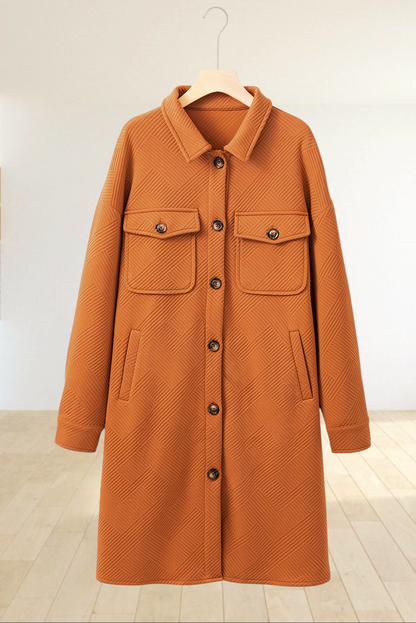 Baya Wear gold longline button-down shirt jacket with geometric texture, drop shoulders, and chest pockets.
