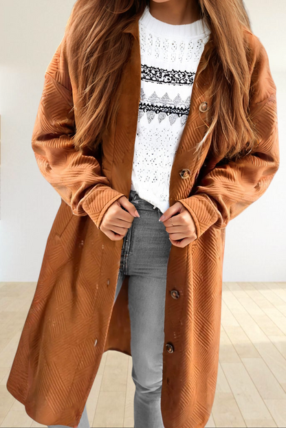 Baya Wear gold textured longline button down shirt jacket with drop shoulders and pockets worn over a white sweater.