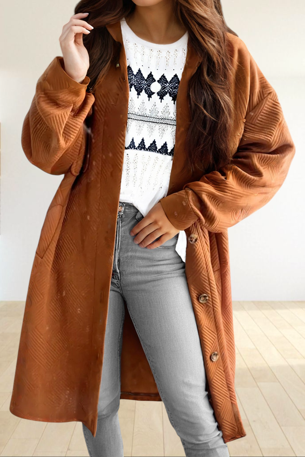 Baya Wear gold textured longline button down shirt jacket worn over a white patterned top and grey jeans