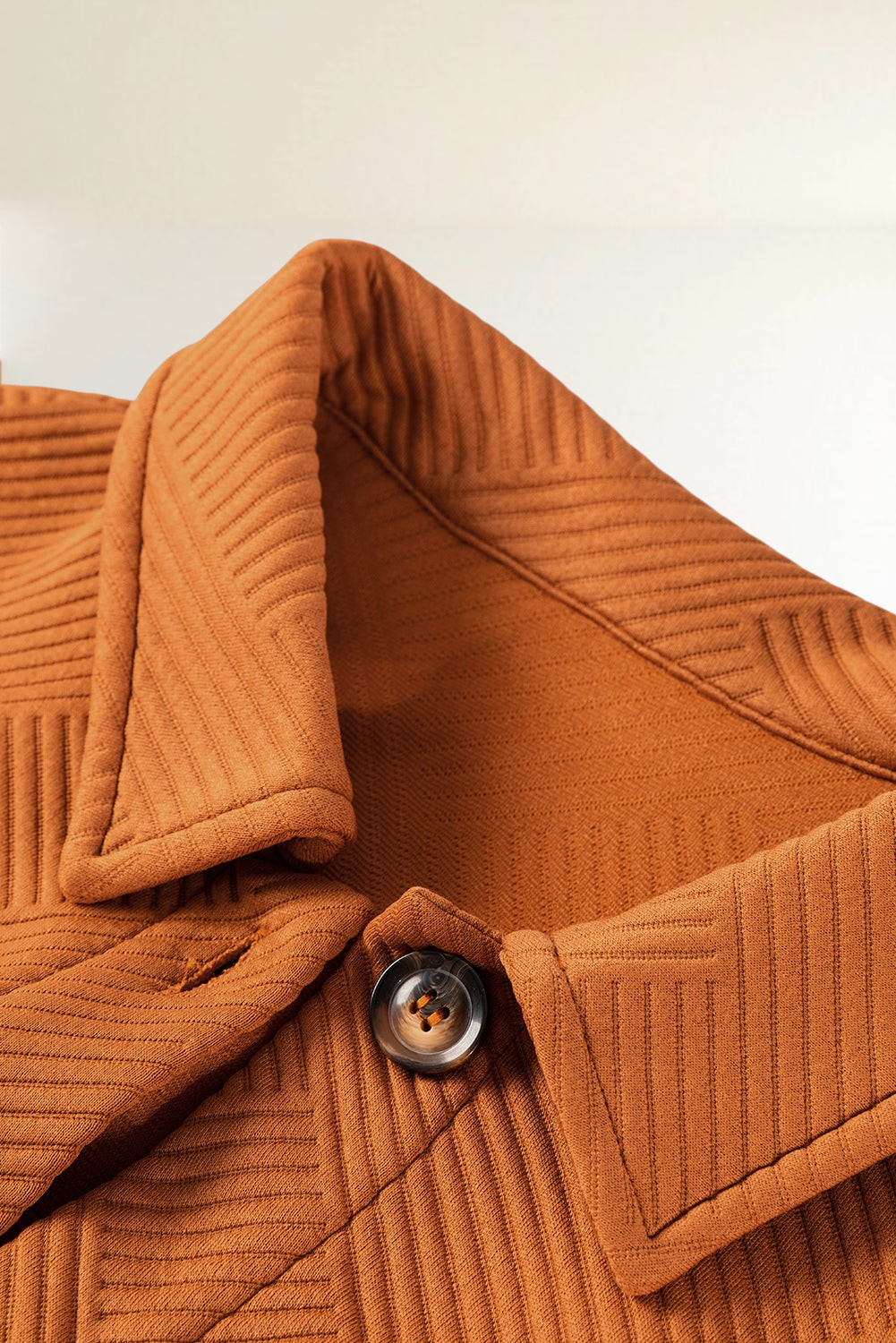 Baya Wear gold flame textured longline shirt jacket featuring a classic collar and button-down front detail.