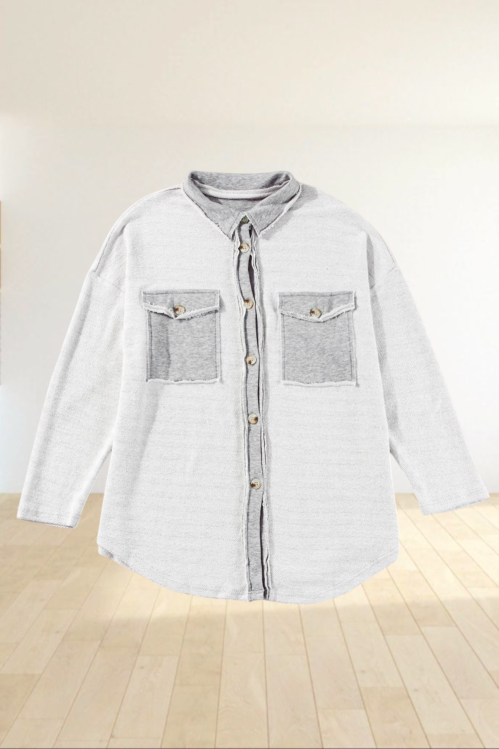 Baya Wear gray relaxed shacket with contrast flap pockets, button-down front, and raw-edge detailing.
