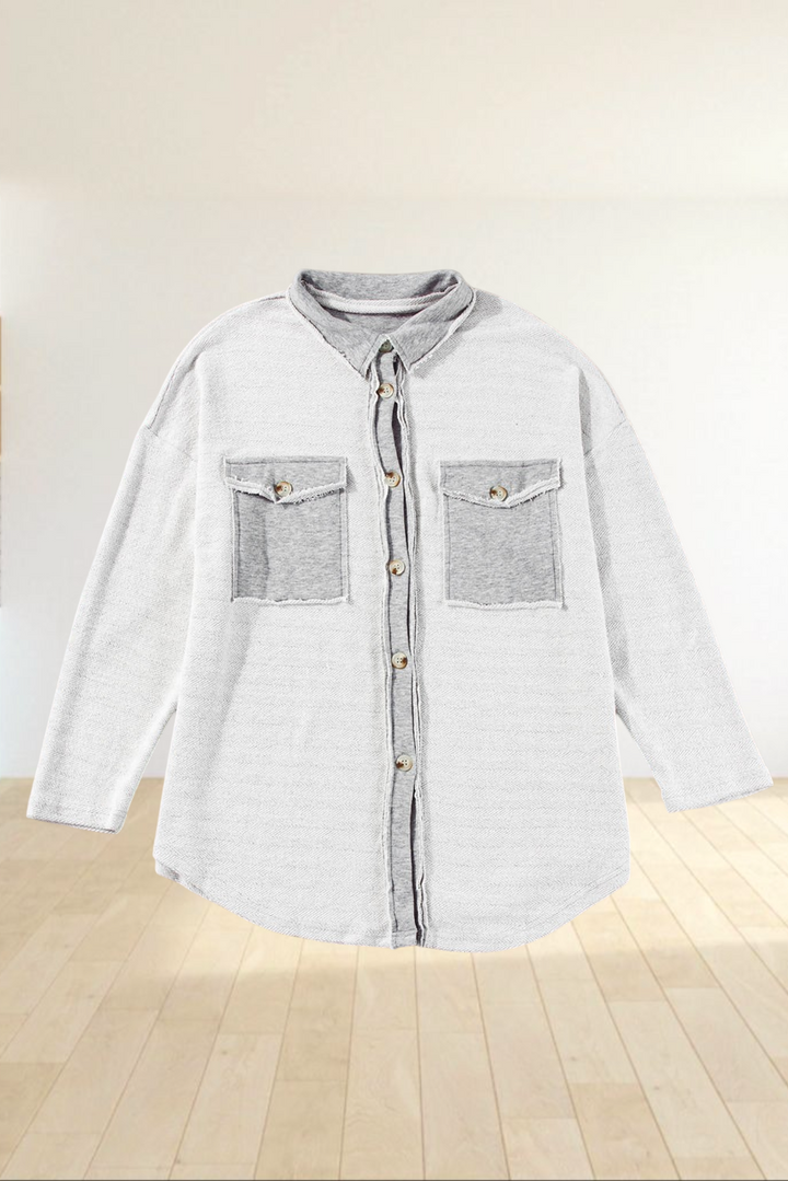 Baya Wear gray relaxed shacket with contrast flap pockets, button-down front, and raw-edge detailing.