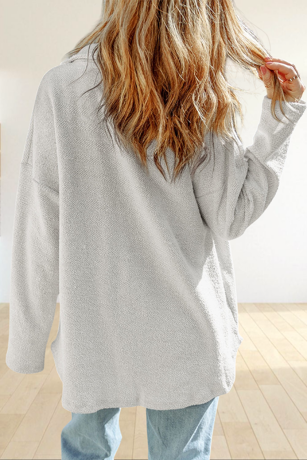 Baya Wear gray textured long sleeve shacket with a relaxed oversized fit seen from the back on a woman