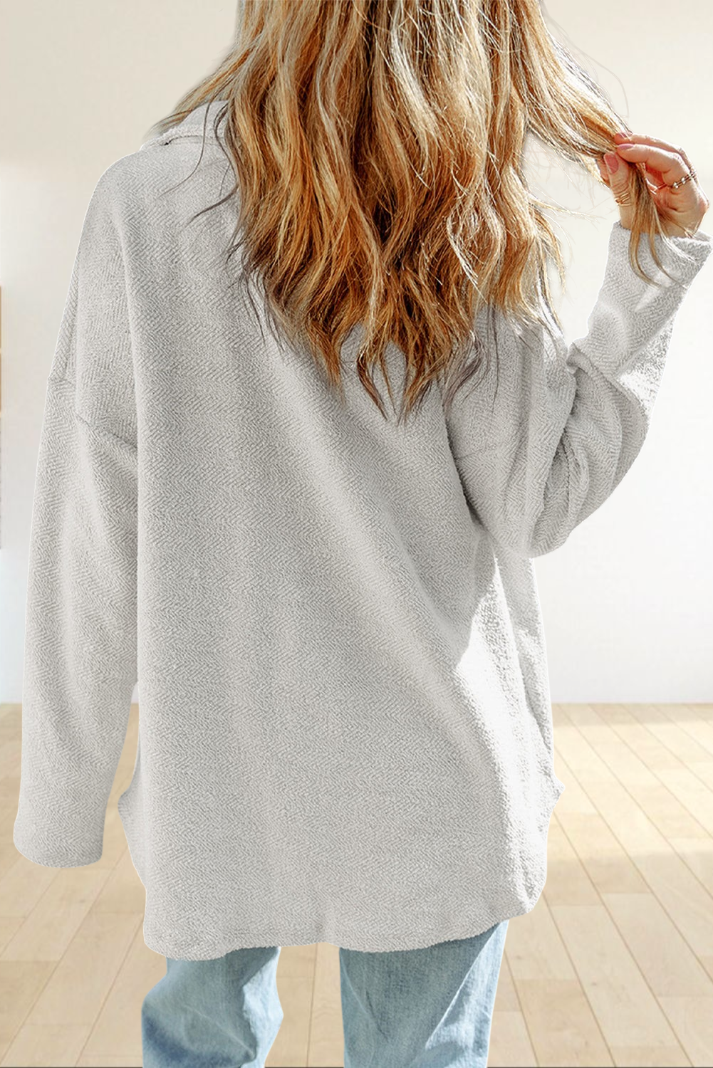Baya Wear gray textured long sleeve shacket with a relaxed oversized fit seen from the back on a woman