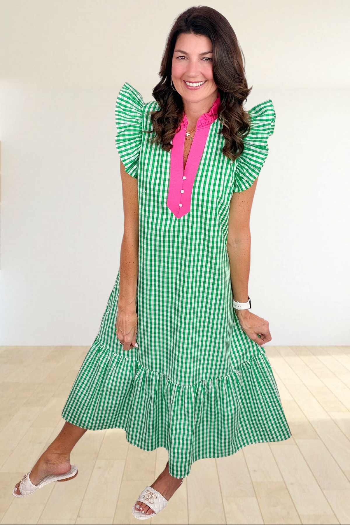 Baya Wear green and white gingham midi dress with hot pink collar, flutter sleeves, and tiered ruffle hem on model