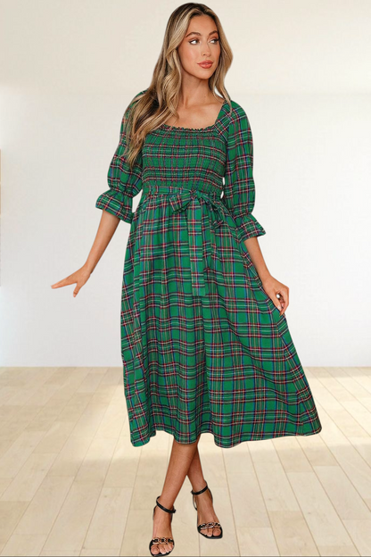 Baya Wear green tartan plaid midi dress with smocked bodice, square neckline, puff sleeves, and waist tie.