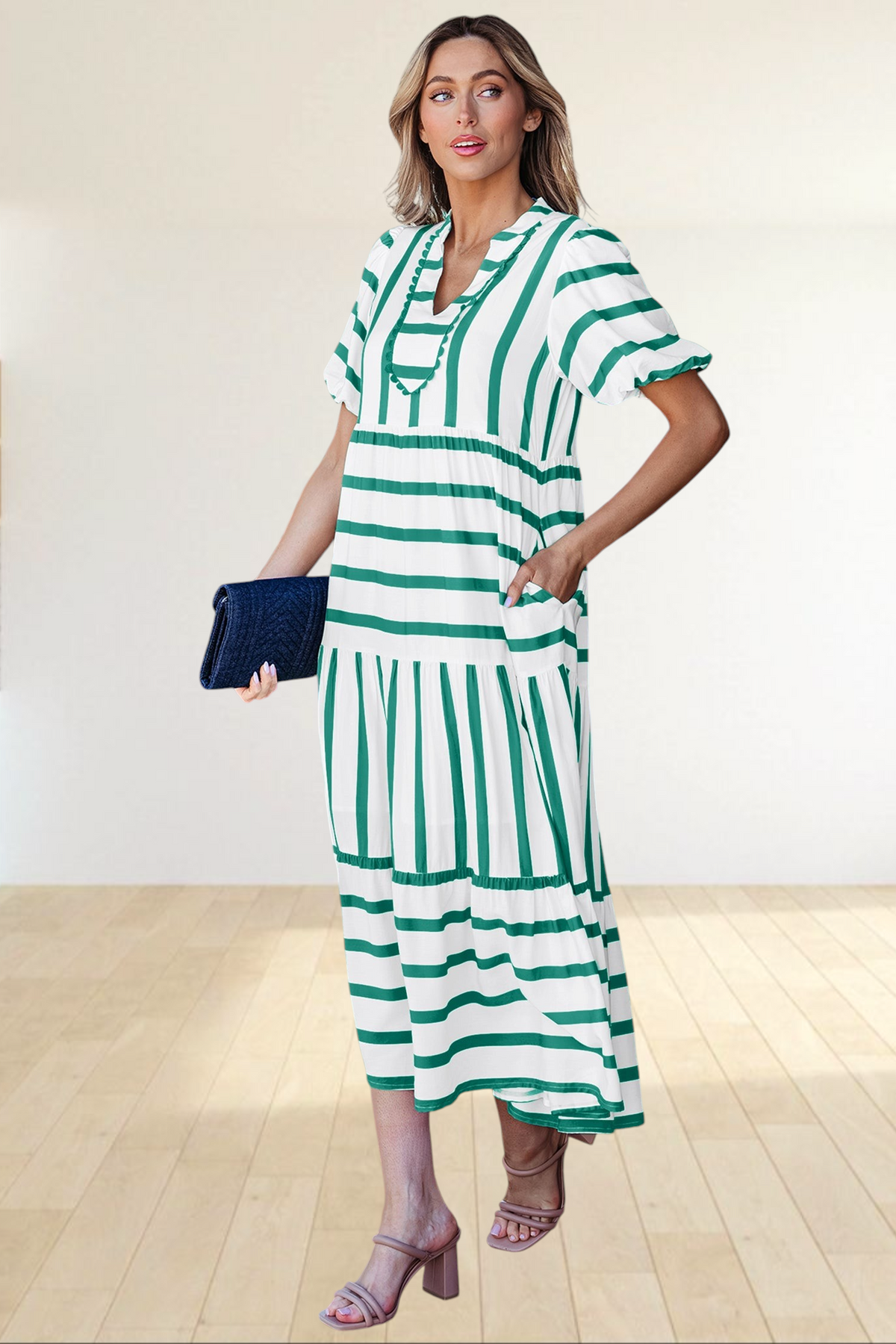 Baya Wear tiered midi dress in white and green stripes with a notched neckline, ricrac trim, and side pockets.