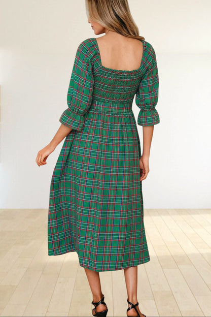 Baya Wear green tartan plaid midi dress with smocked bodice, square neckline, and puff sleeves, back view.