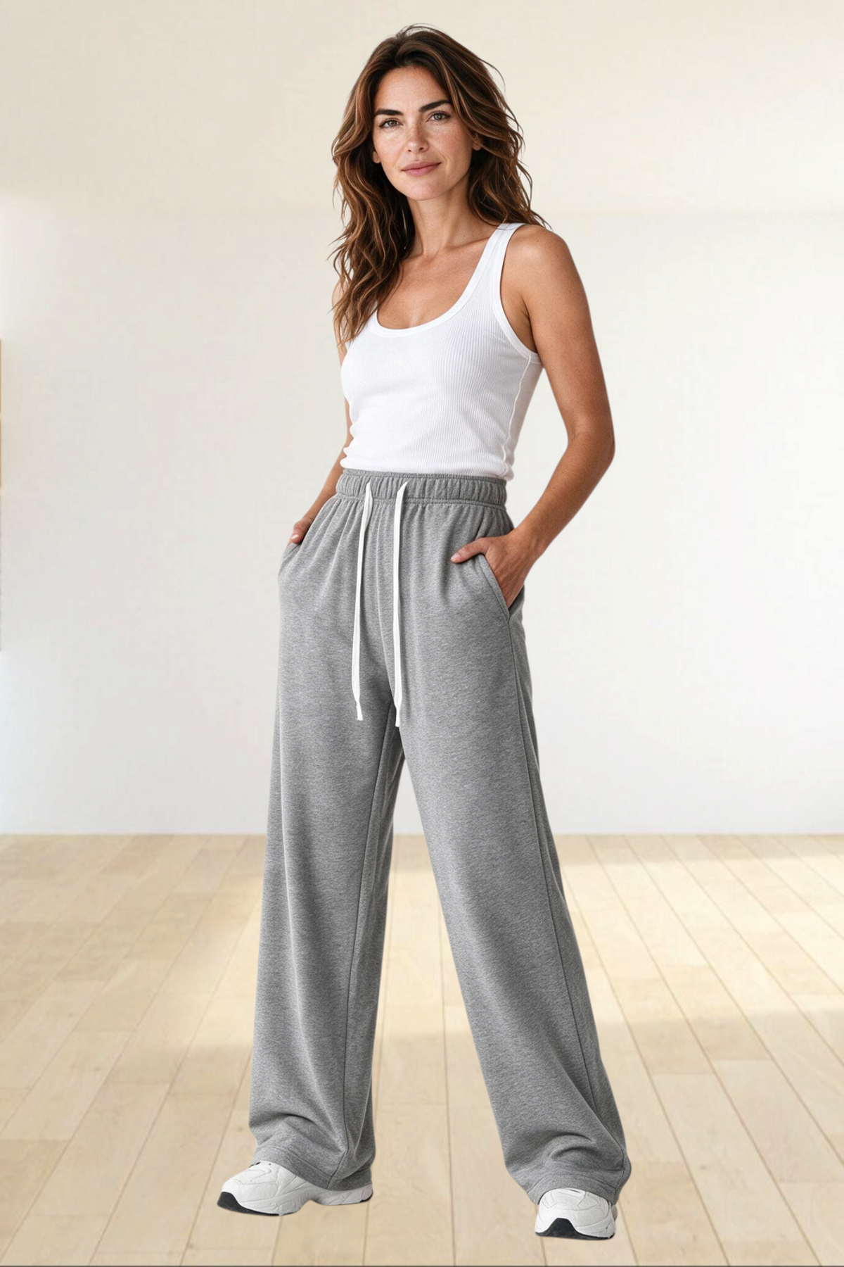Baya Wear women's grey high waisted wide leg lounge sweatpants in polyester fleece with an adjustable drawcord waist.
